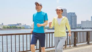 Seniors power walking in the city by the bay