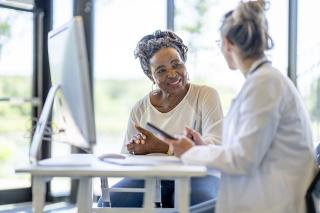 PCP speaking with senior patient about their personalized care plan