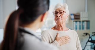 Concerned Elderly patient speaking with doctor